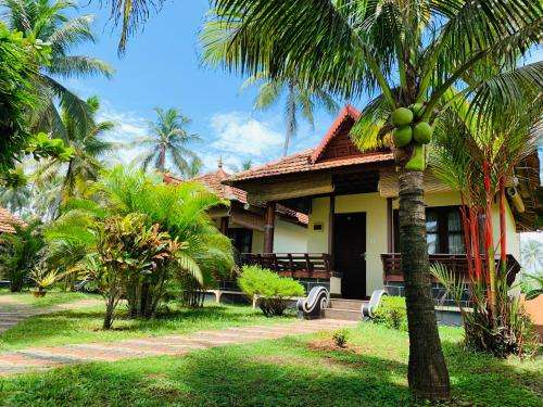 www.maadathilcottages.com