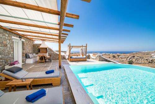 www.villaevimykonos.com
